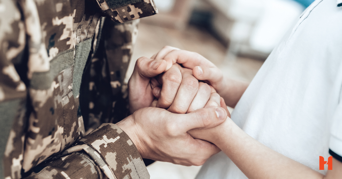 holding the hands of a veteran
